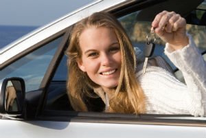 teen driver with car key