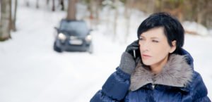 person in the phone with car in the background