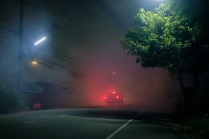 car driving on a foggy night