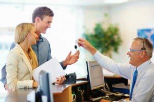 Couple at rental car counter