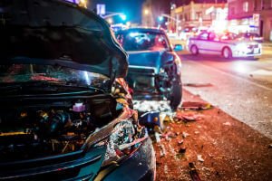 two cars after nighttime accident