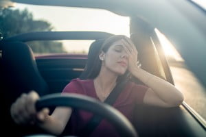 woman falling asleep at the wheel
