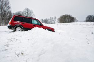 red car in the snow