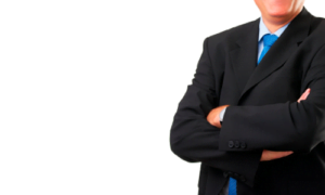 person in a suit with arms folded