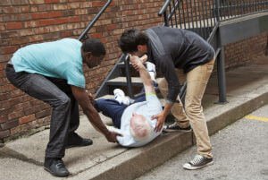 man who fell being helped