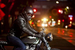 rider waiting to turn on busy street