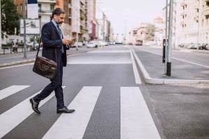 pedestrian crossing street while on phone