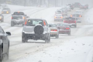 cars driving in the snow
