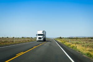 white 18 wheeler on highway