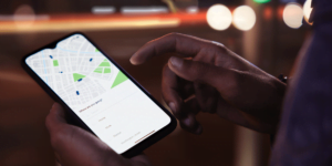 Man holding phone with rideshare app open
