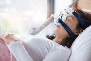 woman using a CPAP machine