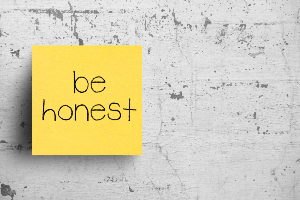 post it note with be honest written