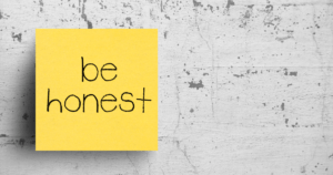 post it note with be honest written