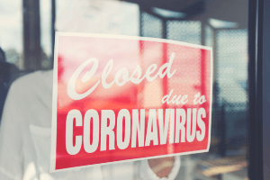 Sign on business window that reads: "closed due to coronavirus"