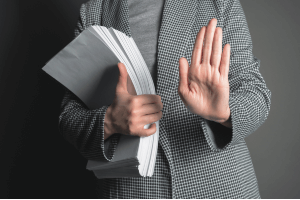 holding up hands holding documents