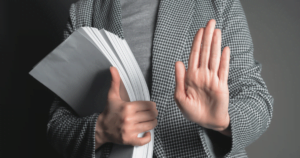 holding up hands holding documents