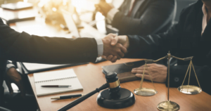 two legal professionals shaking hands
