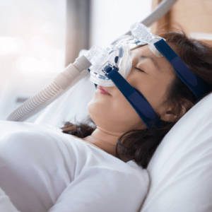 person sleeping while wearing a cpap machine