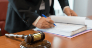 Lawyer filling out legal paperwork.