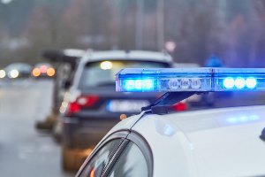police car behind accident scene