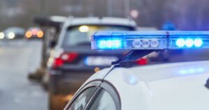 police car behind accident scene
