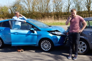 two drivers on phones after a crash
