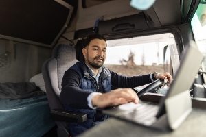 truck driver using a laptop