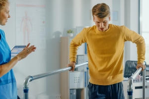 person learning how to walk