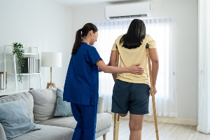 A women with an amputated leg learning to walk again.