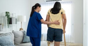 A women with an amputated leg learning to walk again. 