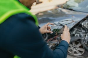 snapping pics of wrecked car