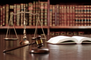 A table with a gavel and a book on top