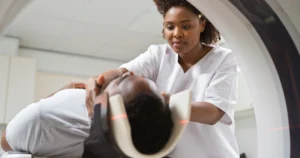 A man getting an MRI from a doctor.