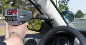 A police speedometer on the road.