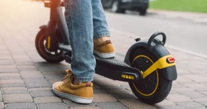 close up of feet on an electric scooter