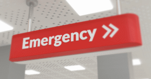 Interior sign pointing to the emergency room