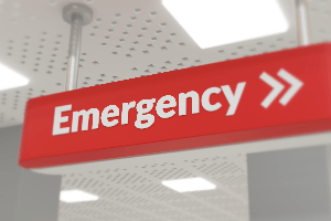 Interior sign pointing to the emergency room