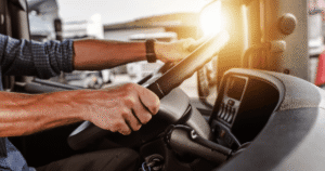 close-up of truck driver behind the wheel